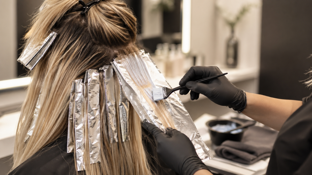Professional hair color service with foils at Salon Alure