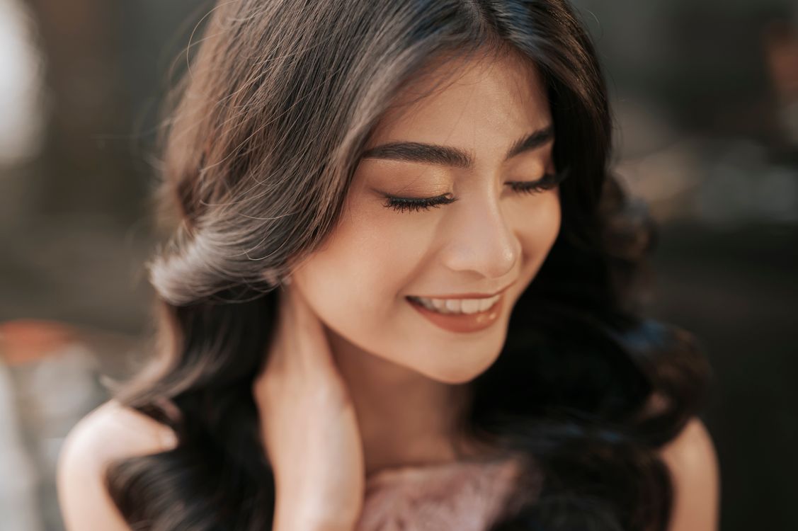 Smiling woman with beautifully styled, voluminous fine hair