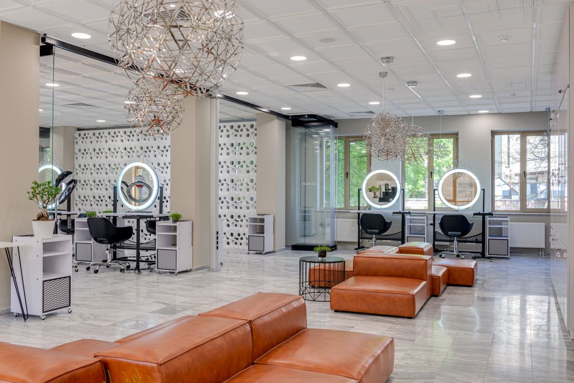 Stylish beauty salon interior with booth rental stations and elegant decor
