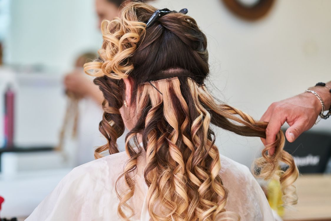 Woman with beautiful highlighted hair color result from salon