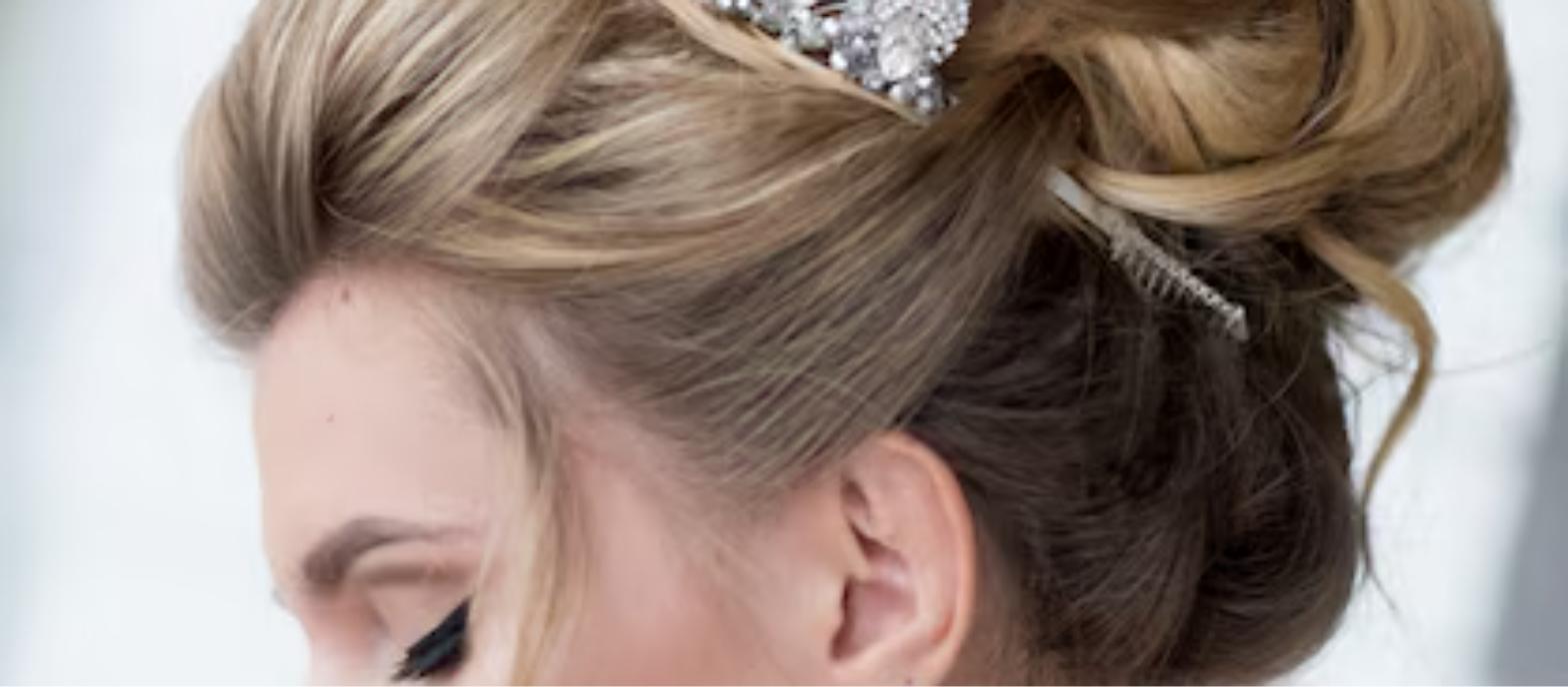 Bridal hair updo with silver hair vine for a wedding day, styled by Salon Alure
